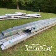 Steel Building Parts Laying in Grass
