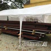 Red Iron Beams Under a Tent